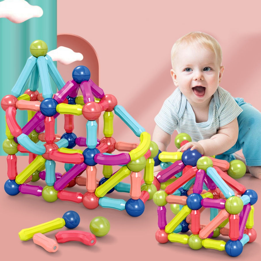 Magnetic Building Blocks — child building a house